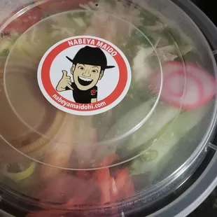 a salad in a plastic container