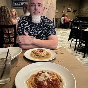 a man sitting at a table in a restaurant