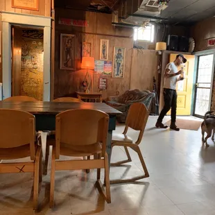 a man and a dog in a restaurant