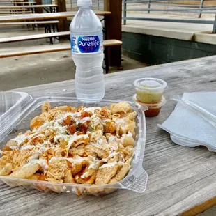 Buffalo chicken nachos with pork grind base instead of chips for no carbs