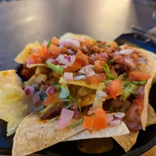 a plate of nachos on a table