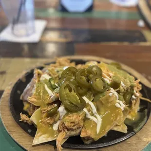 Enchilada nacho with green sauce