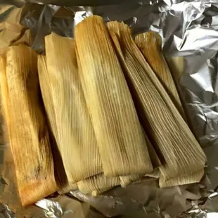 three tamales in foil