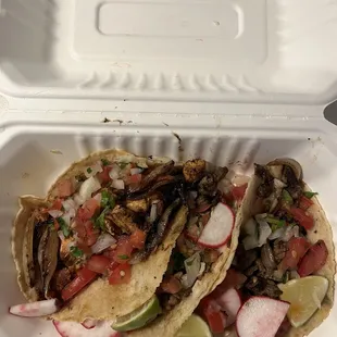 two asada tacos and one chicken taco