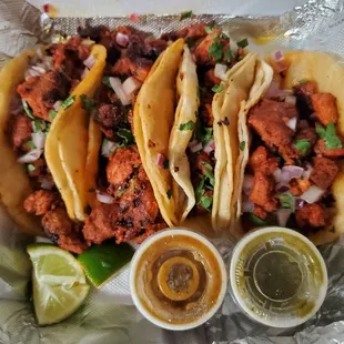 4 al pastor tacos $12