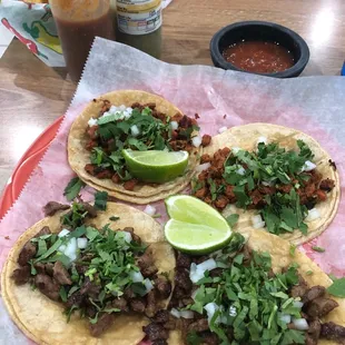 Tacos al pastor and steak tacos.