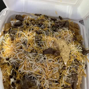 Supreme Nacho with carne asada.  Cheese wasn&apos;t even melted.