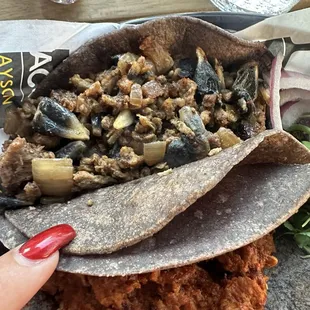 Americano (Blue Corn) Combination of  asada and huitlacoche in a blue corn tortilla. Maybe I&apos;ll skip the huitlacoche.
