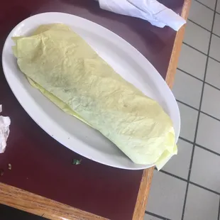 Huge burrito doesn't even fit in the wrapper