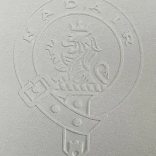 The embossed logo on the menu