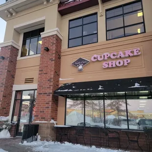 the outside of a cupcake shop