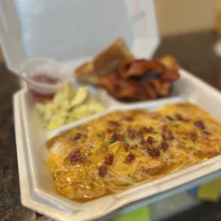 a meal in a styrofoam container