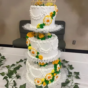 Our wedding cake. Three layers of white cake, each layer filled with a different fruit filling: lemon, strawberry, and blueberry