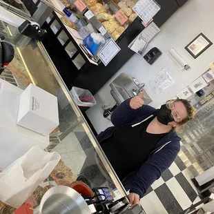 Riley helping me pick out treats! The shelves filled with bread at 7am!