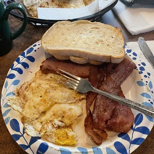 Eggs, bacon, ham, toast, and coffee all 100% superb