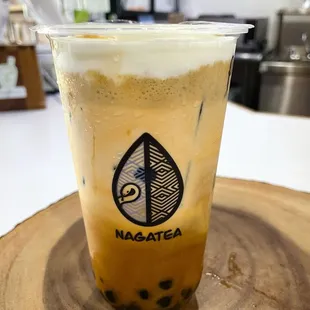 Pandan Caramel Thai Tea with brown sugar boba and salted cream.