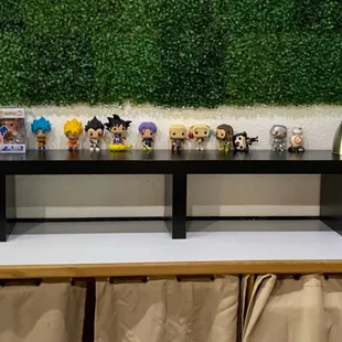 a row of pop vinyl figures on a table