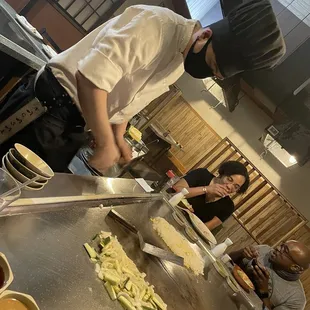 a chef preparing food in a restaurant