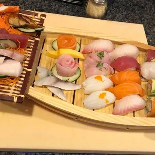 Love boat!one rainbow roll and 10pcs sushi 18pcs of sashimi