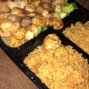 a meal of shrimp, broccoli and rice