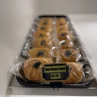 a tray of ramen and bakery items
