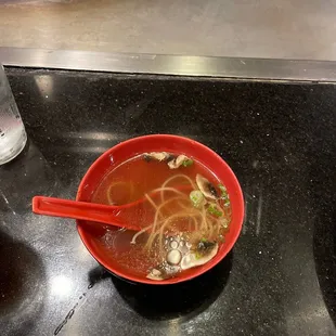 a bowl of soup and a bowl of noodles