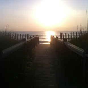 Walkway to beach from hotel. I caught the sunrise on my phone :)