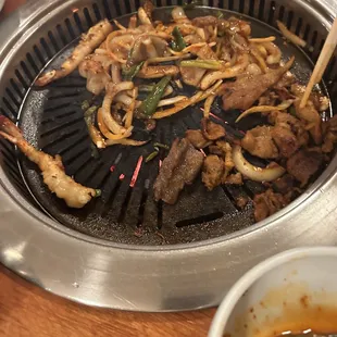 a grill with various types of food