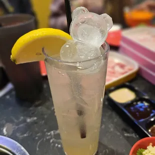 a glass of lemonade with a slice of lemon