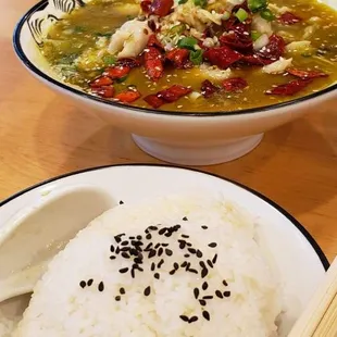 Signature Sauerkraut soup with Basa fish. Fluffy, perfect rice topped with black sesame.