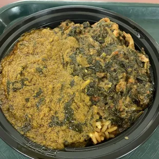 Spinach stew and palm date stew over jollof rice
