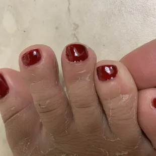 Uneven gel, complete with lumps. All she did was just pick at it rather than fix it.