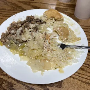 Pork chop special over rice - black eyed peas and boiled cabbage.  The jalapeño cornbread is gone already.