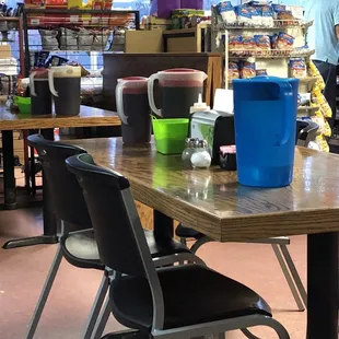 Sweet tea pitchers are placed on tables for refills