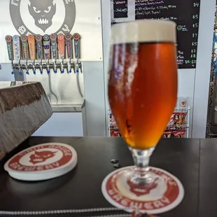 a glass of beer on a table