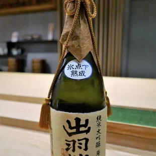a bottle of sake on a table