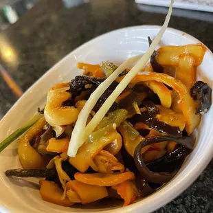 a plate of stir fried vegetables