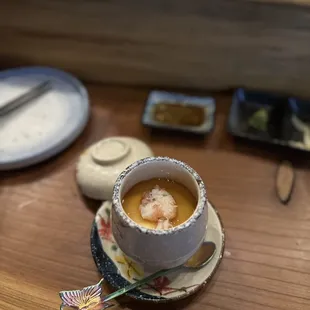 a cup of soup on a saucer