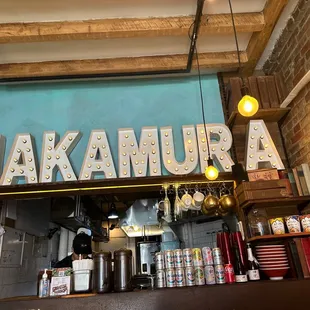 the sign above the counter of a restaurant