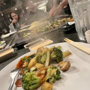 a plate of stir fried vegetables