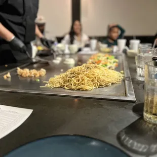 a chef preparing a meal at a restaurant