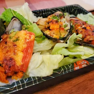 a plate of seafood and lettuce