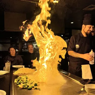 a chef in a restaurant preparing food