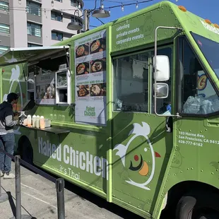 a woman ordering food from a food truck