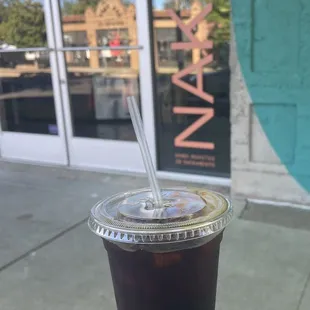 a cold drink in a plastic cup