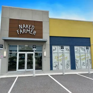 Storefront view with dedicated curbside pickup parking spaces.