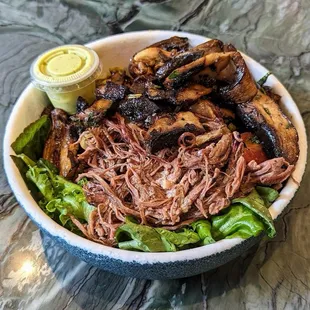 Slow-braised steak, farm greens with mint, blue oyster mushrooms and garlic aioli.