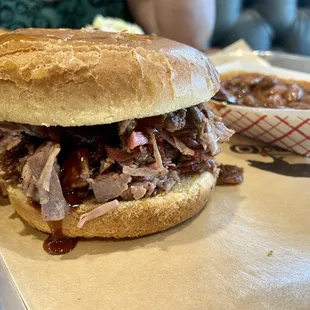 Chopped brisket sandwich with a side of beans. Delish!