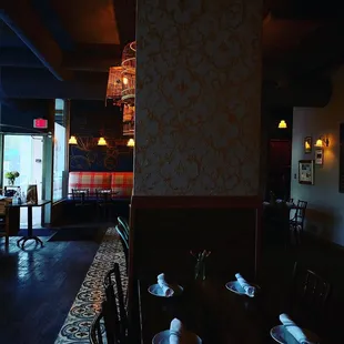 a dining room with a table and chairs