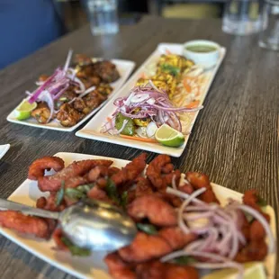 three plates of food on a table